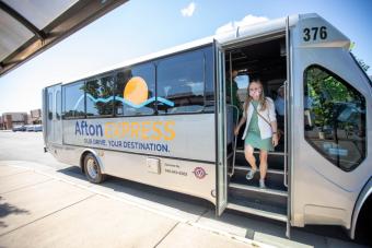 Woman exiting Afton shuttle